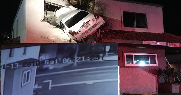 Car goes airborne, slams into 2nd floor of building and stays there