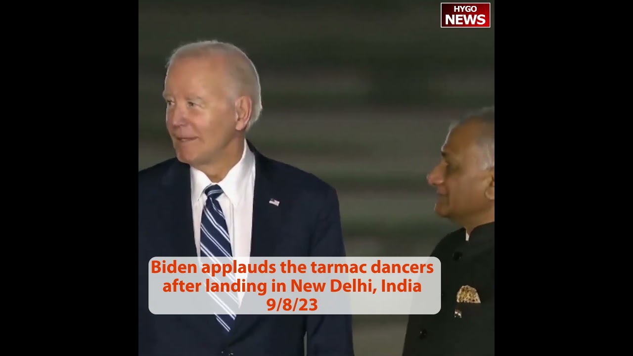 Biden applauds the tarmac dancers after landing in New Delhi, India